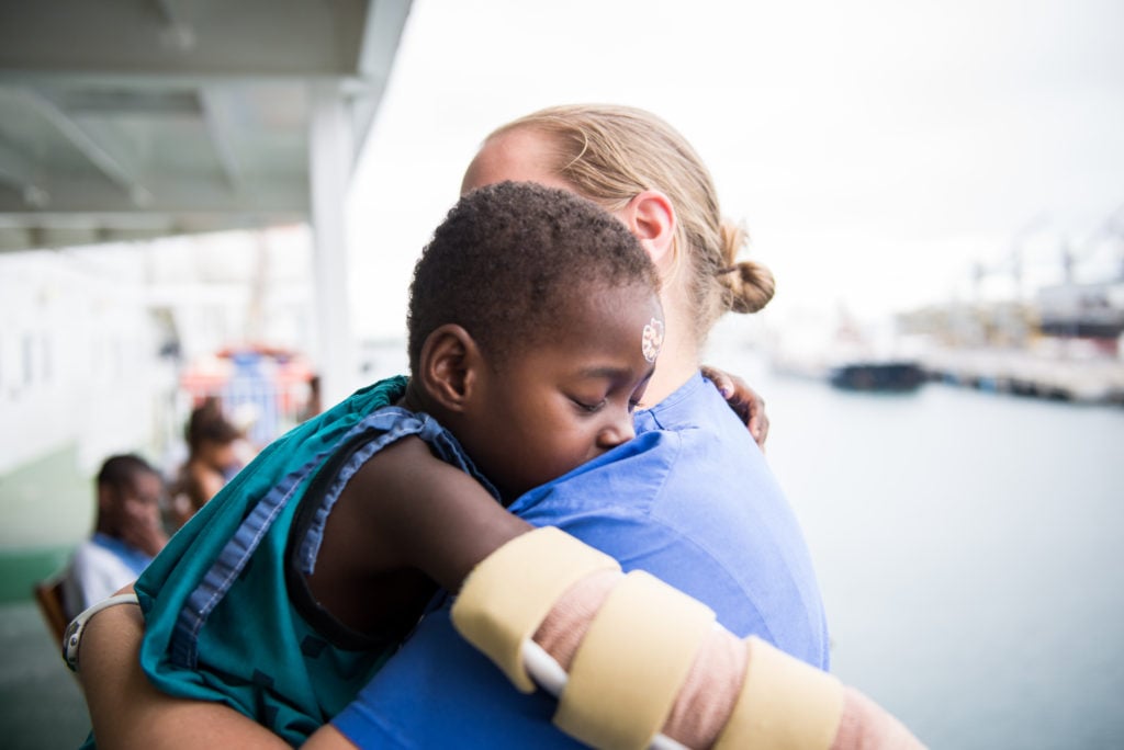 © 2016 Mercy Ships, Photo Credit Ruben Plomp; Sasimeny (MGC09516) with Jenny MULLIS (USA) Ward Nurse