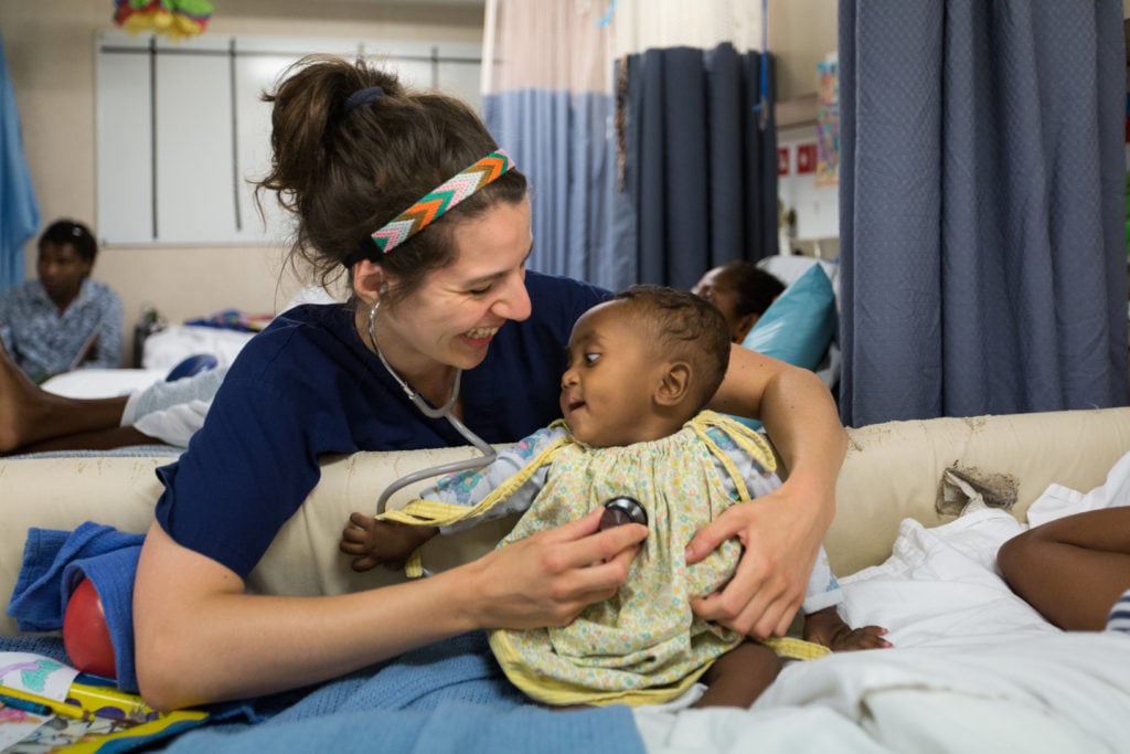 ©2016 Mercy Ships - Photo Credit Katie Keegan - Ward Nurse Lucie HOMRICH (DEU) cares for a patient
