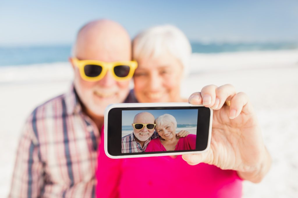 Senior couple taking selfie