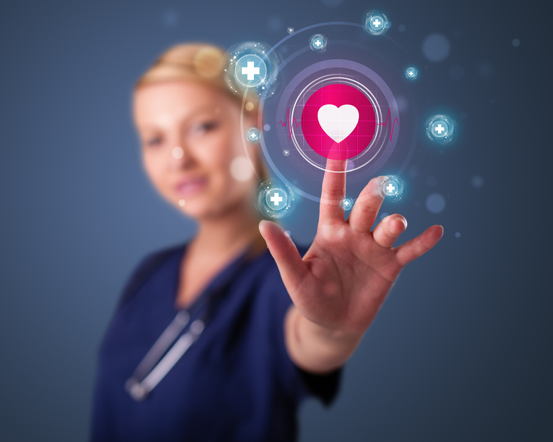 Young pediatric nurse pressing modern medical type of buttons