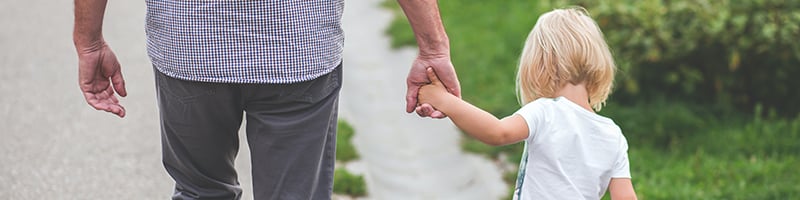 child walking with parent