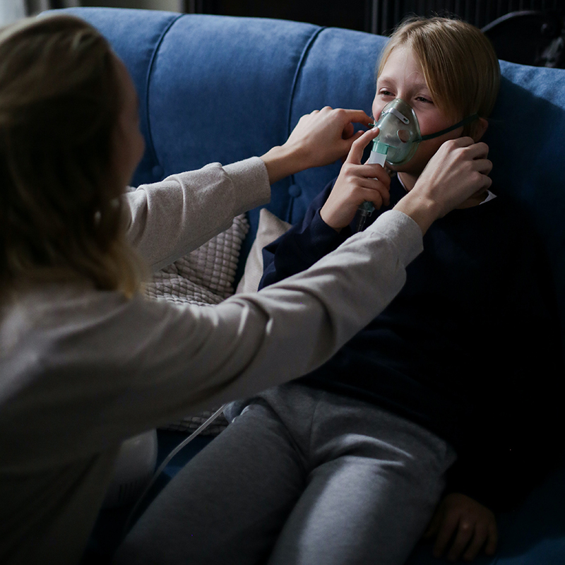 child wearing oxygen mask
