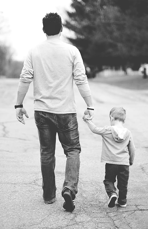 father and son walking
