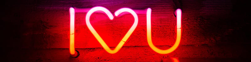 neon sign says I heart u