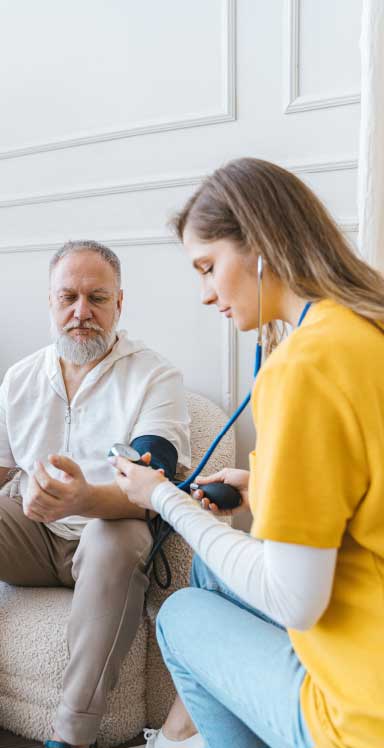 Nurse taking a patient's blood pressure
