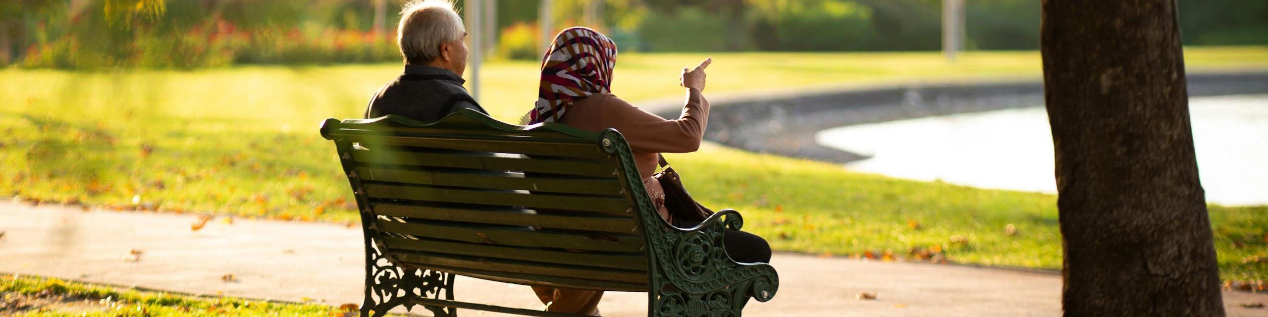 Elderly Couple on a Park Bench